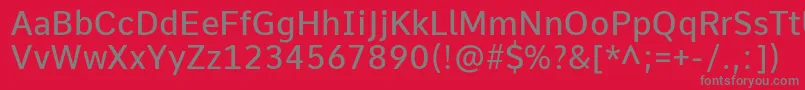フォントCommeMedium – 赤い背景に灰色の文字