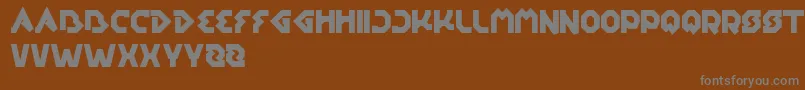EarthAircraftUniverse-fontti – harmaat kirjasimet ruskealla taustalla