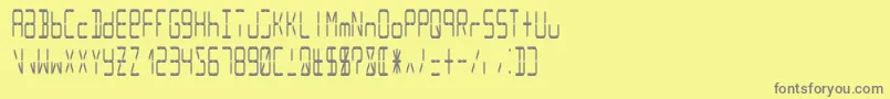 Lcd14condensed-Schriftart – Graue Schriften auf gelbem Hintergrund