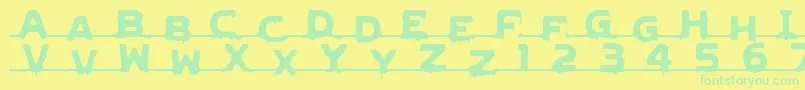 LvdcGncdRmx2-Schriftart – Grüne Schriften auf gelbem Hintergrund