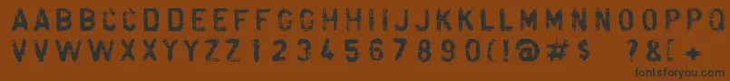 フォントFibra – 黒い文字が茶色の背景にあります