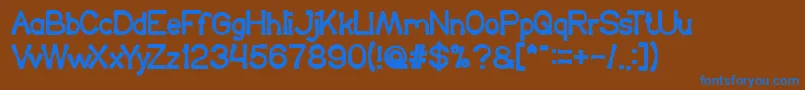 KingOfTheWorld Font – Blue Fonts on Brown Background