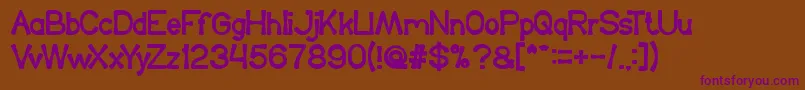 KingOfTheWorld Font – Purple Fonts on Brown Background