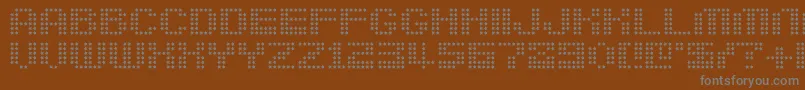 Berirg-fontti – harmaat kirjasimet ruskealla taustalla