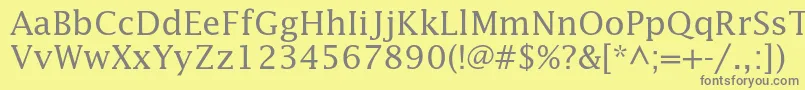 Lucidastd-fontti – harmaat kirjasimet keltaisella taustalla