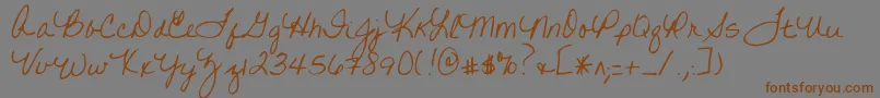 フォントWrittenonhishands – 茶色の文字が灰色の背景にあります。