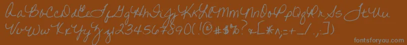 フォントWrittenonhishands – 茶色の背景に灰色の文字