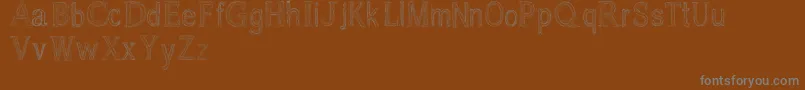 Czcionka Usang – szare czcionki na brązowym tle