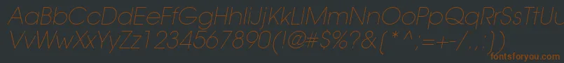 Fonte TrendexLightSsiExtraLightItalic – fontes marrons em um fundo preto