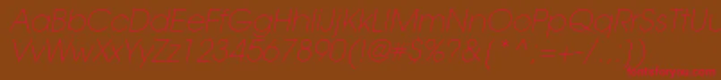 Fonte TrendexLightSsiExtraLightItalic – fontes vermelhas em um fundo marrom