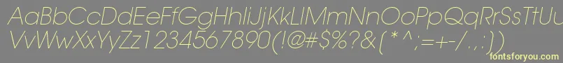 TrendexLightSsiExtraLightItalic-Schriftart – Gelbe Schriften auf grauem Hintergrund