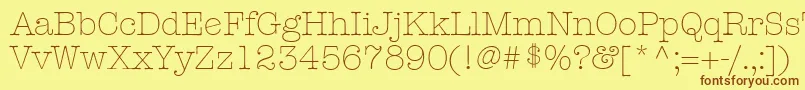 フォントKeyboardLightAlternateSsiLightAlternate – 茶色の文字が黄色の背景にあります。