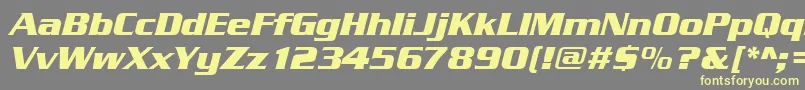 SerpentinedeebolItalic-fontti – keltaiset fontit harmaalla taustalla