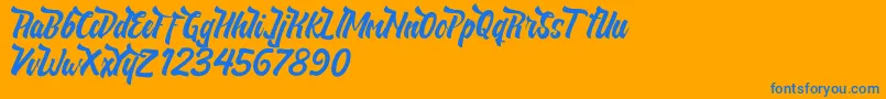 NeldaFree-Schriftart – Blaue Schriften auf orangefarbenem Hintergrund