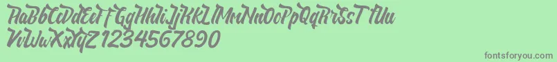 フォントNeldaFree – 緑の背景に灰色の文字