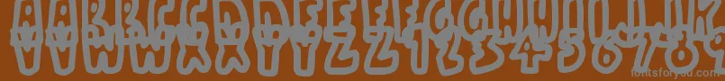 BareBones-fontti – harmaat kirjasimet ruskealla taustalla