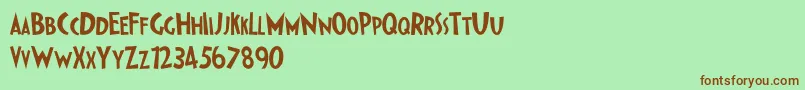 IpkissZf-fontti – ruskeat fontit vihreällä taustalla