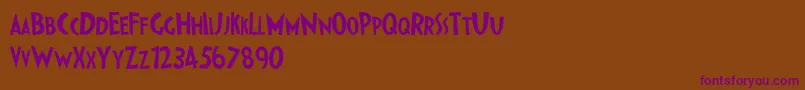 フォントIpkissZf – 紫色のフォント、茶色の背景