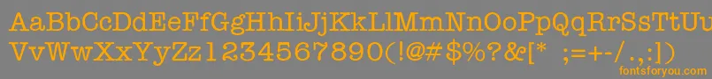 フォントFt56 – オレンジの文字は灰色の背景にあります。