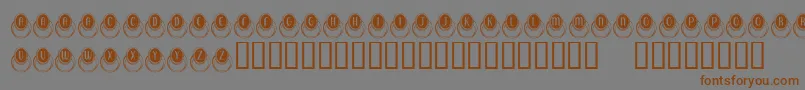 KrMoodRing-Schriftart – Braune Schriften auf grauem Hintergrund