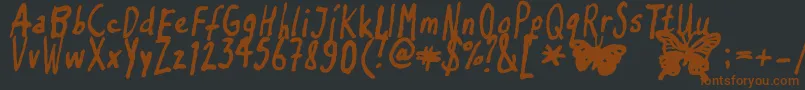 Inkyflutterby Font – Brown Fonts on Black Background