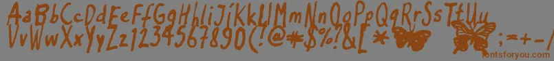 Inkyflutterby Font – Brown Fonts on Gray Background