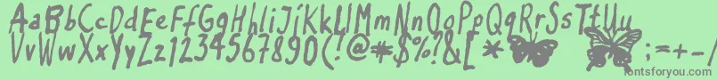 Czcionka Inkyflutterby – szare czcionki na zielonym tle