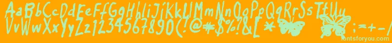 Inkyflutterby Font – Green Fonts on Orange Background