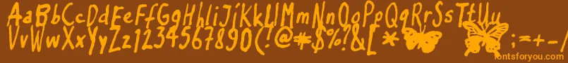 Inkyflutterby Font – Orange Fonts on Brown Background