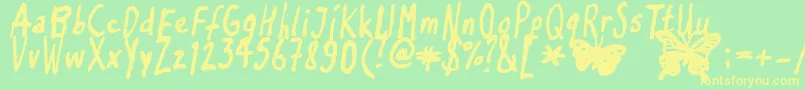 Inkyflutterby Font – Yellow Fonts on Green Background