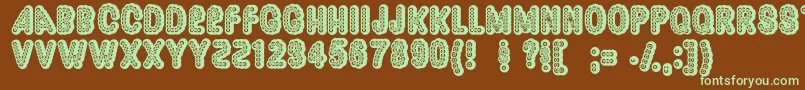 フォントDazzler ffy – 緑色の文字が茶色の背景にあります。