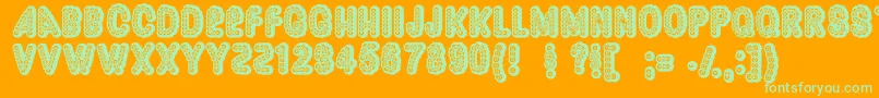 Dazzler ffy-Schriftart – Grüne Schriften auf orangefarbenem Hintergrund