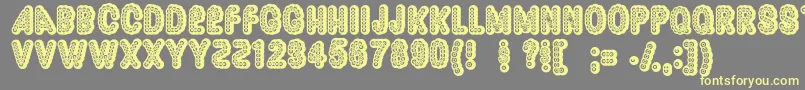Dazzler ffy-Schriftart – Gelbe Schriften auf grauem Hintergrund