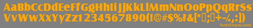 フォントNautodisplayssk – オレンジの文字は灰色の背景にあります。