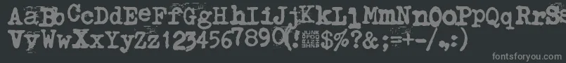 フォントTypistys – 黒い背景に灰色の文字