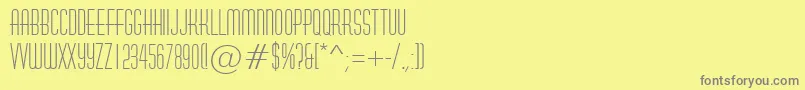 フォントAHuxley – 黄色の背景に灰色の文字