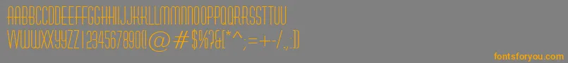 フォントAHuxley – オレンジの文字は灰色の背景にあります。