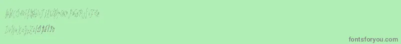 Więcej informacji o czcionce Lasthand Czcionka Lasthand – szare czcionki na zielonym tle