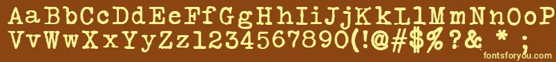 SilkremingtonSbold-fontti – keltaiset fontit ruskealla taustalla