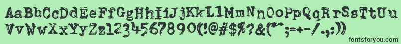 DumboldtypewriterDoublepunch-fontti – mustat fontit vihreällä taustalla