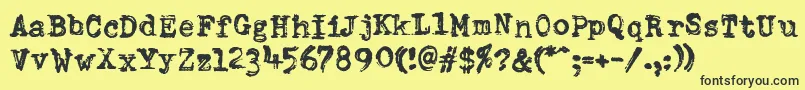 DumboldtypewriterDoublepunch-fontti – mustat fontit keltaisella taustalla