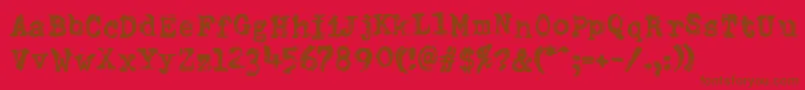 DumboldtypewriterDoublepunch-fontti – ruskeat fontit punaisella taustalla