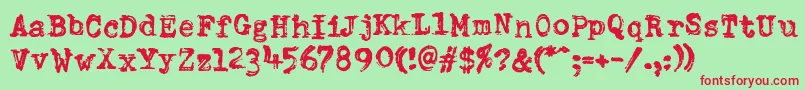 DumboldtypewriterDoublepunch-fontti – punaiset fontit vihreällä taustalla