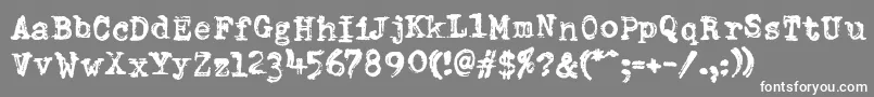 DumboldtypewriterDoublepunch-fontti – valkoiset fontit harmaalla taustalla