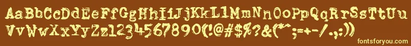 DumboldtypewriterDoublepunch-fontti – keltaiset fontit ruskealla taustalla