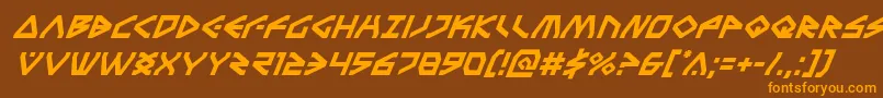 フォントTerrafirmasuperital – オレンジ色の文字が茶色の背景にあります。