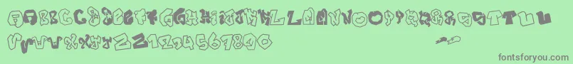 JokerSize-fontti – harmaat kirjasimet vihreällä taustalla