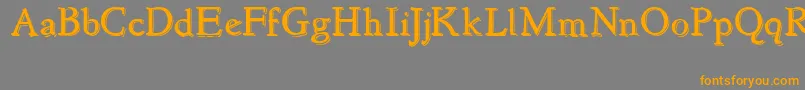 フォントNewstyleEmbossed – オレンジの文字は灰色の背景にあります。