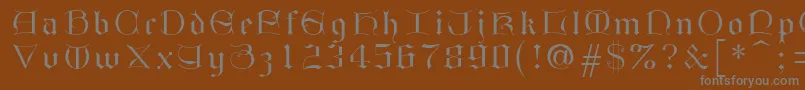 フォントGothici – 茶色の背景に灰色の文字