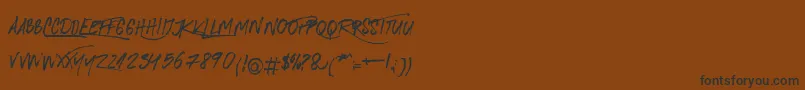 フォントRoyalTwins – 黒い文字が茶色の背景にあります